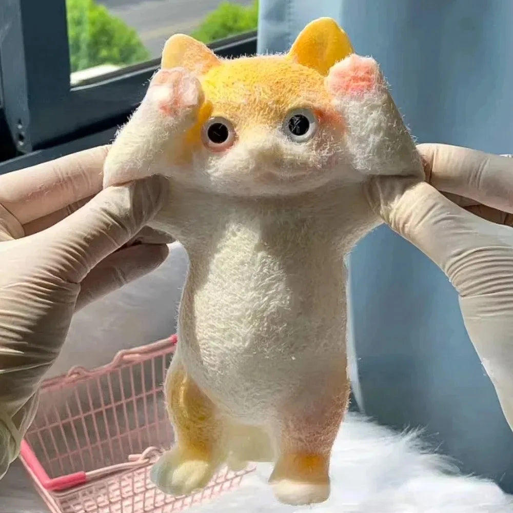 Fluffy cat squishy being held